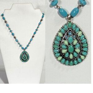 18" silver-tone and turquoise colored pendant necklace.